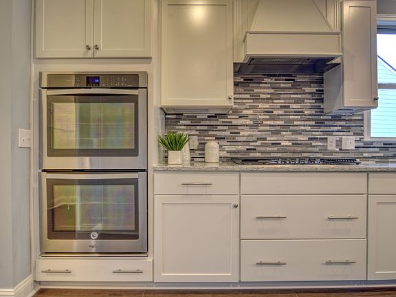 Wall Oven and Microwave with an included backsplash- Model Representation
