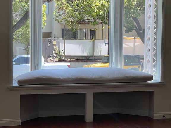 Close up of bay window seating with cushion