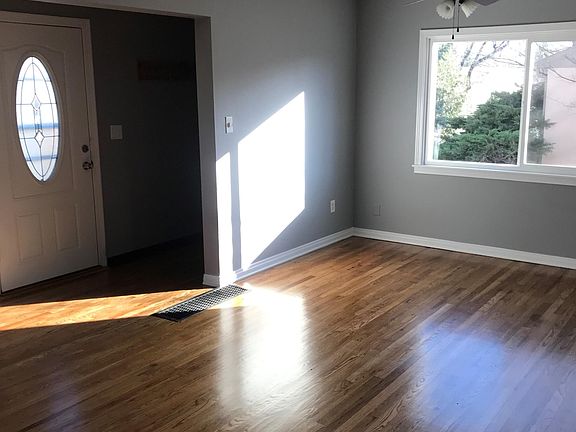 Giant, brand new picture window in dining room. Professionally refinished hardwood floors.