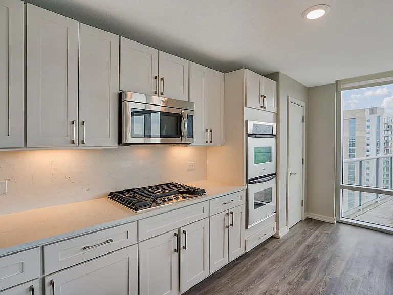 Penthouse kitchens are complete with high-end appliances and quartz countertops