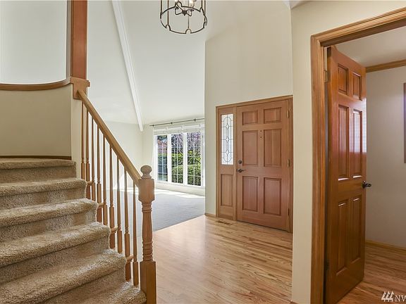 Once inside the 2-story foyer, gleaming hardwoods open to formal living and dining rooms.