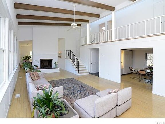 Living room with fireplace, entrance to dining room