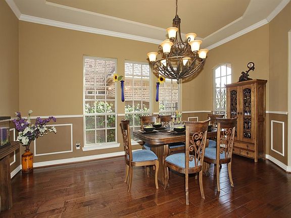 A graceful, 2-story entrance welcomes you home...