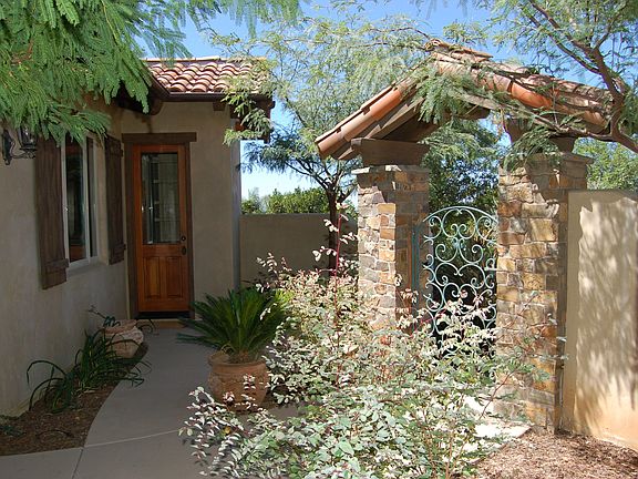 Enter through quaint Portal into lush courtyard