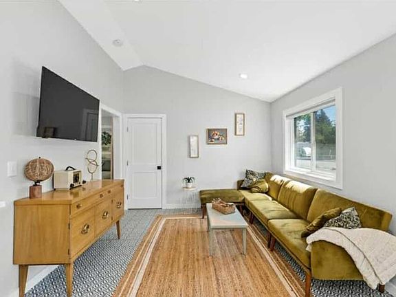 Living room-Relax in the bright and cozy living room,featuring a plush sectional, smart TV, and fast Wi-Fi