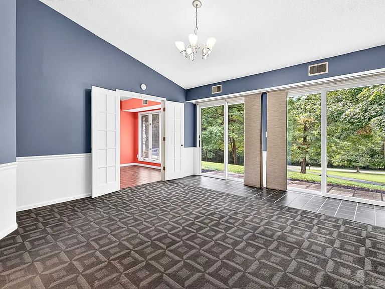 Primary Bedroom
Both doors open to a small patio big enough for a bench or small table and chairs.