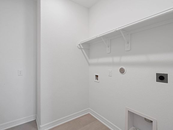Utility room. Note Sample product photo. Actual exterior and interior selections may vary by homesi