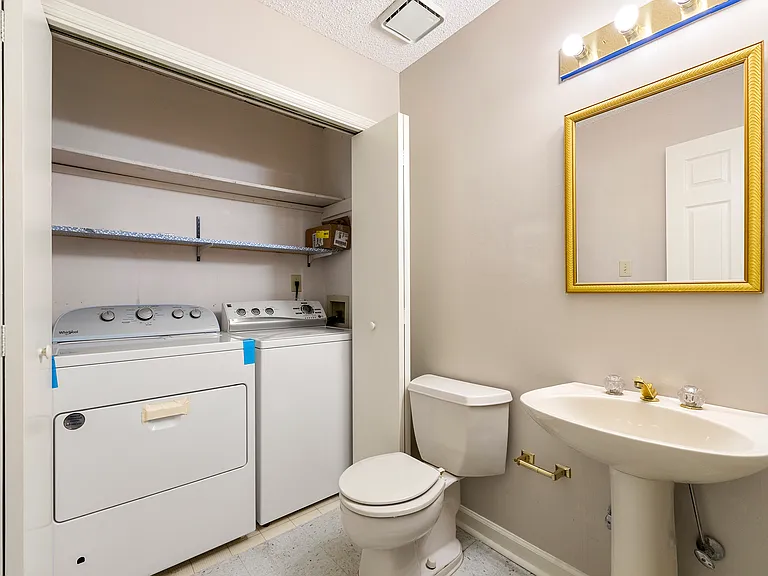 Half bath and laundry downstairs. Laundry appliances were recently replaced and are included.