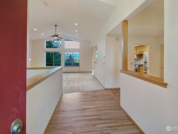 Gorgeous entry with hardwoods, vaulted ceilings and look at those views>