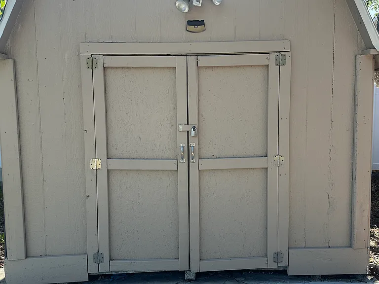 Large, lockable storage shed. Perfect for bikes and seasonal items.
