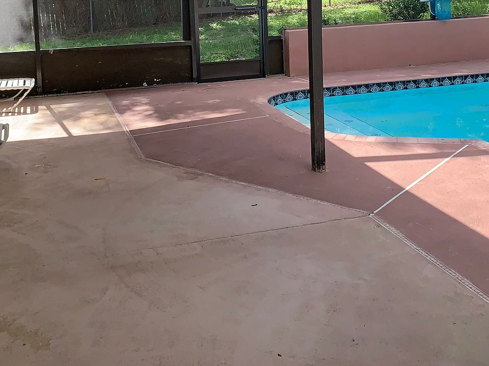 This is the decking outside the living room to the pool. Good sized for a large table.