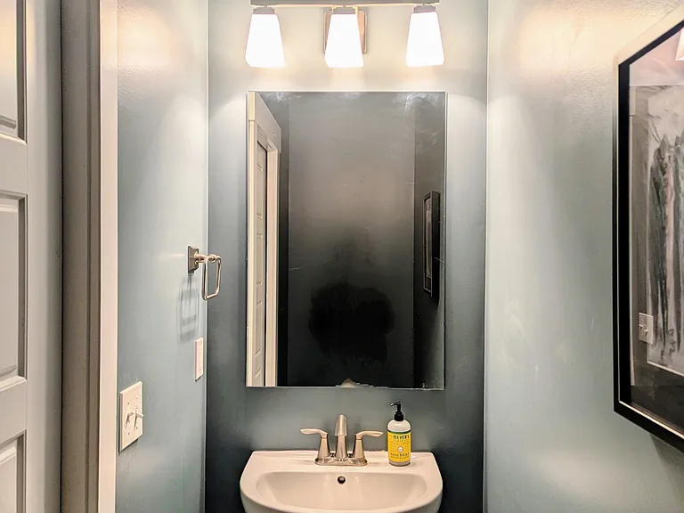 Powder room just off the kitchen/great room area perfect for guests.