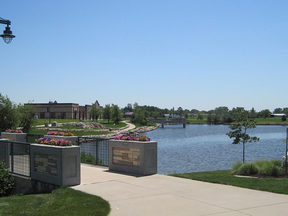 Liberty Centre Pond with trails, waterfall, pier, trails, an