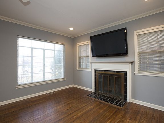 Fireplace with mantel in living area