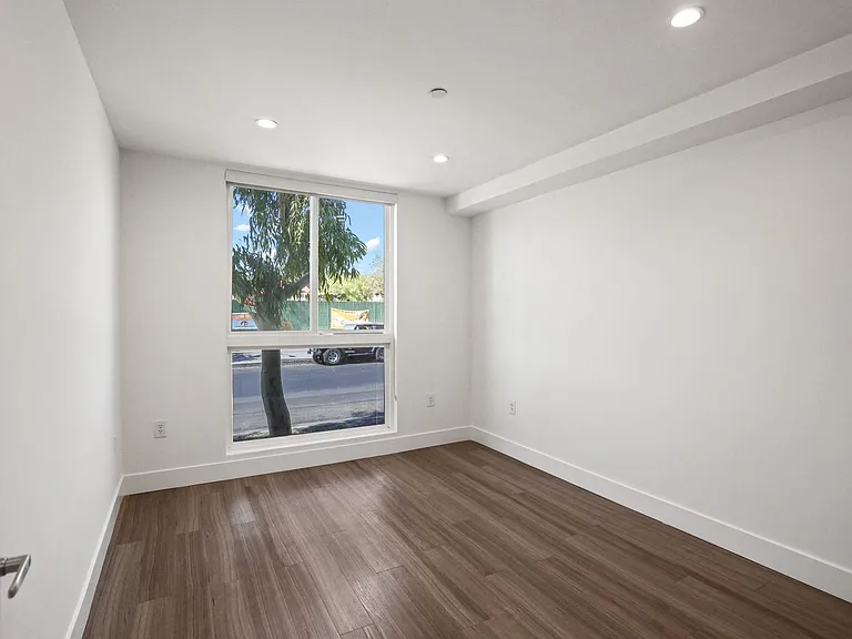 Bedroom with Recessed Lighting, Vinyl Flooring, and Large-Size Windows