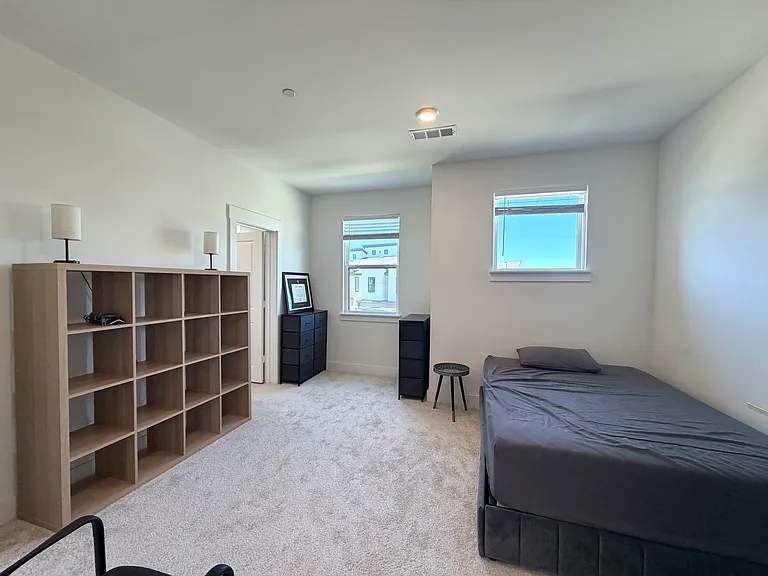 The second bedroom is spacious and well separated from the primary suite.