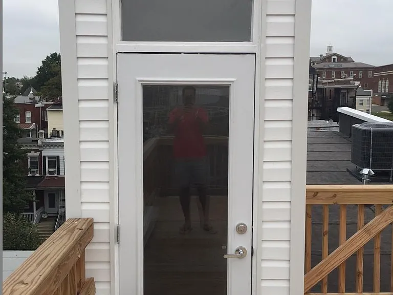 Rooftop entrance, facing north and going into condo