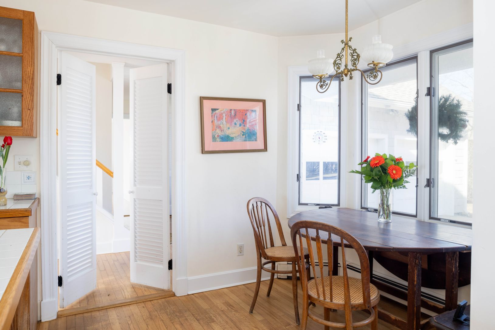  Breakfast nook in walk in bay overlooks covered porch and garden
