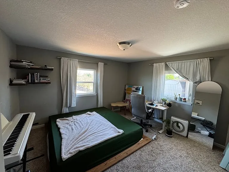 Bedroom 1 - large room, large closet, with east/south facing windows