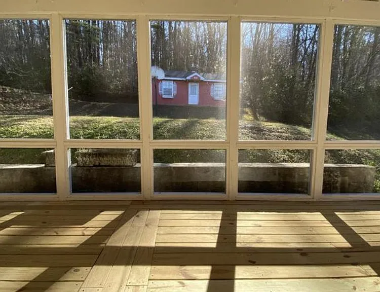Large screened in deck overlooking the large backyard waiting for you to create an outdoor oasis