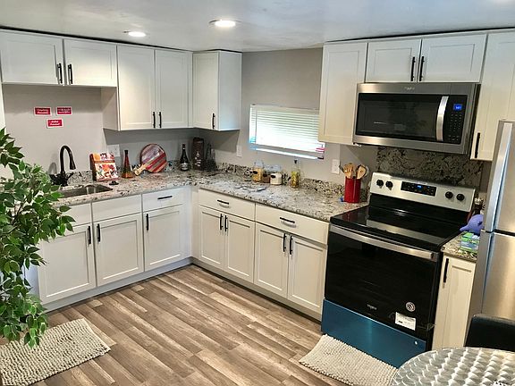 ALL stainless steel appliances. Recently updated cabinets and countertop. Includes full size refrigerator, stove/oven, microwave, and dishwasher. Counter space galore!