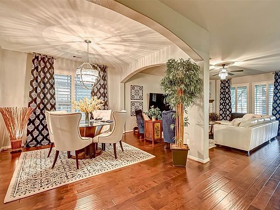 Sun drenched formal dining room. Open space great for entertaining.