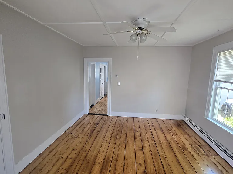 Living room facing kitchen.