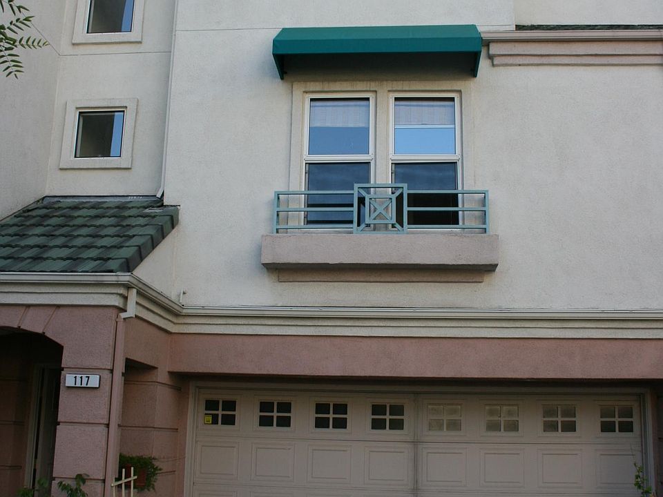 Entrance opening into the courtyard. Garage has washer / dryer, lots of storage. Stairs lead to the second level where you will find the kitchen, breakfast nook, family room, dinning area, patio and half bath.