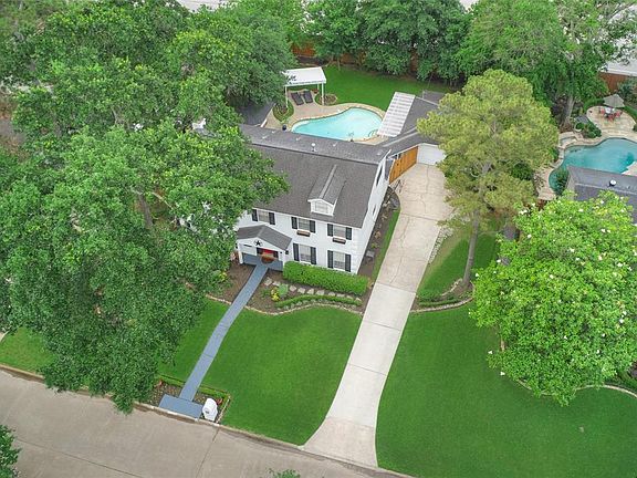 This colonial style home sits on a spacious lot with impeccable attention to landscaping and detail.