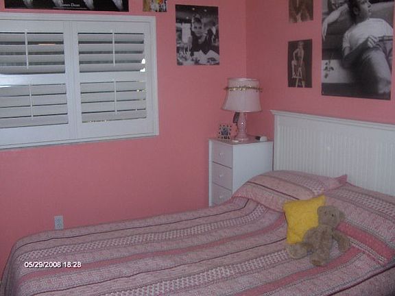 wood shutters in bedroom