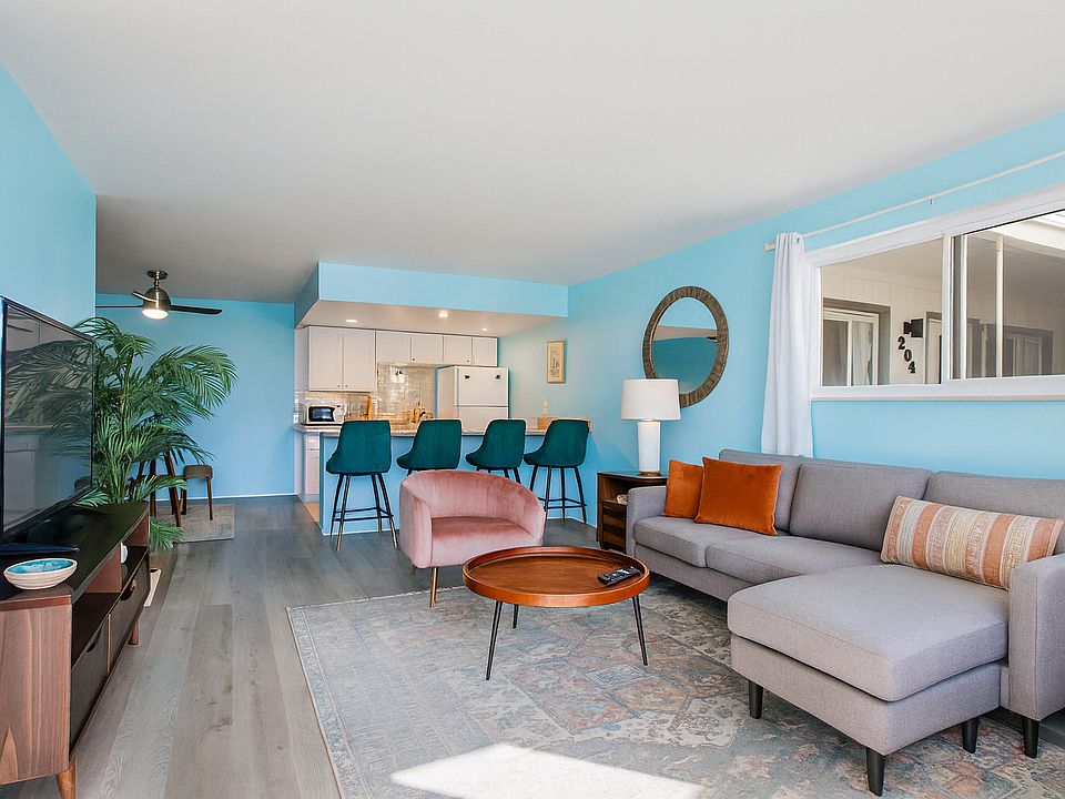 This vibrant living space opens effortlessly into the kitchen and dining area, making it easy to gather, cook, relax _ or do it all at once.