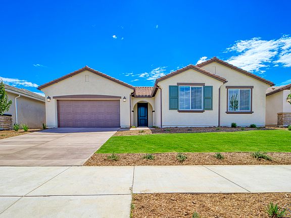 Enjoy front yard landscaping and included solar panels