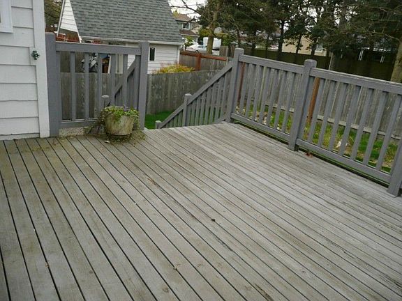 Large deck leads to yard. East and West sun in Summer. Shed is behind an RV/boat driveway. Note fence keeps pets inside regular yard.