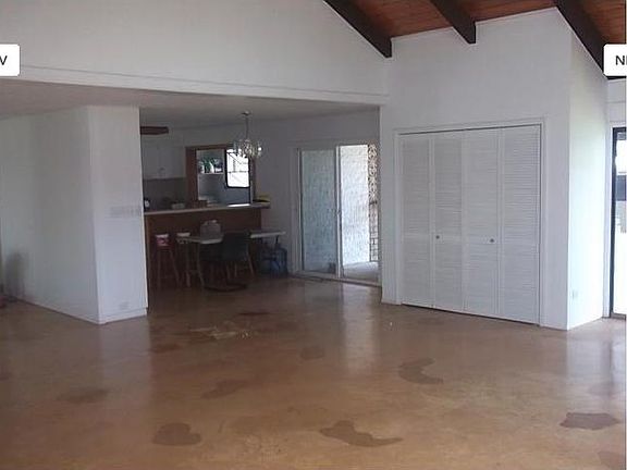 VIEW FROM 25' X 25' FAMILY ROOM LOOKING TOWARD DINING AREA & KITCHEN. CLOSETS ON EACH SIDE OF FAMILY ROOM ARE SUITABLE FOR COMPUTER DESKS, PRINTERS, ETC.
