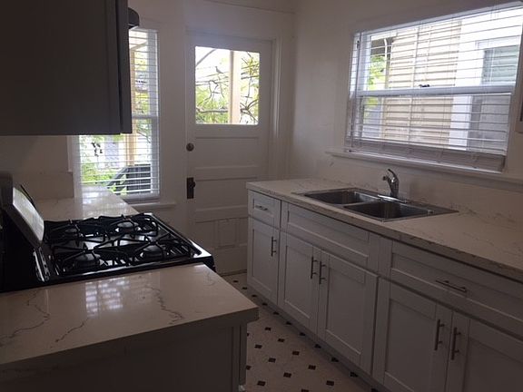 access stairway to downstairs shared gated courtyard to rear of property.