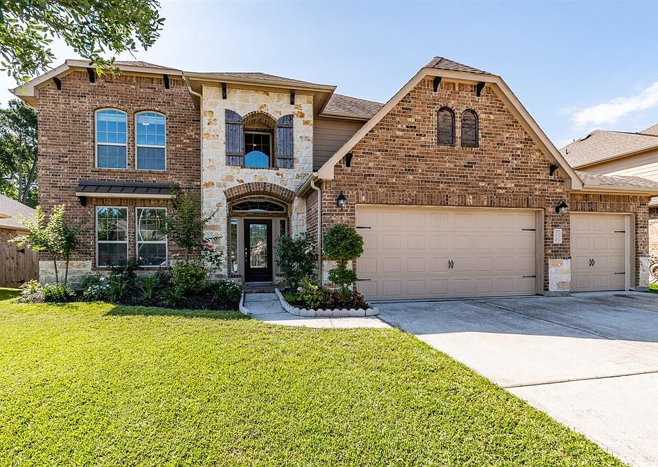 Stunning Two Story Brick/Stone Home Features an Open Concept throughout!