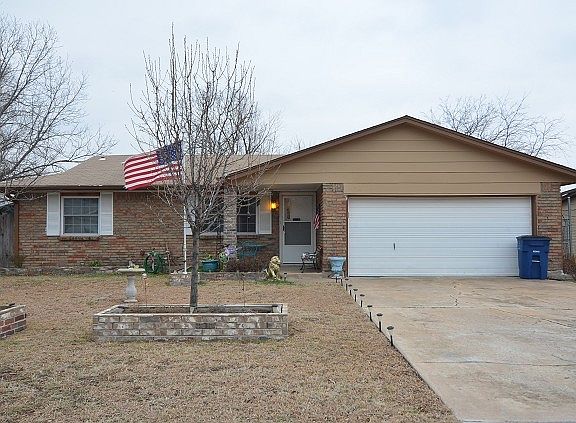 Covered porch and 2-car garage