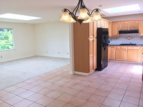 Open floor plan of Dining room looking back at the Living Room & Kitchen