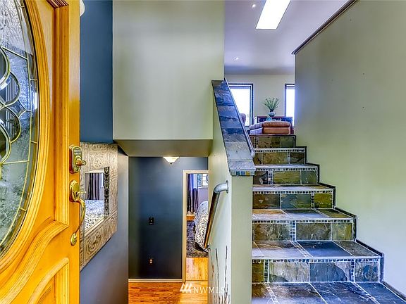 As you enter, living area to the right, two guest rooms and full bath to the left.