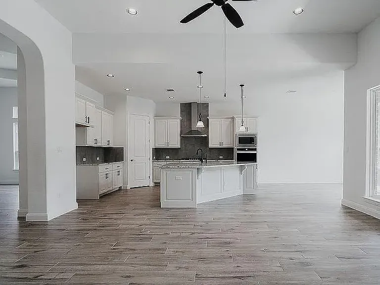 Kitchen with a small view of the dining room on the left