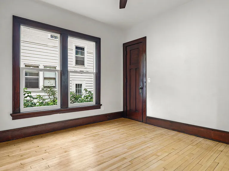 Front bedroom, Ceiling fan and blonde hardwoods!