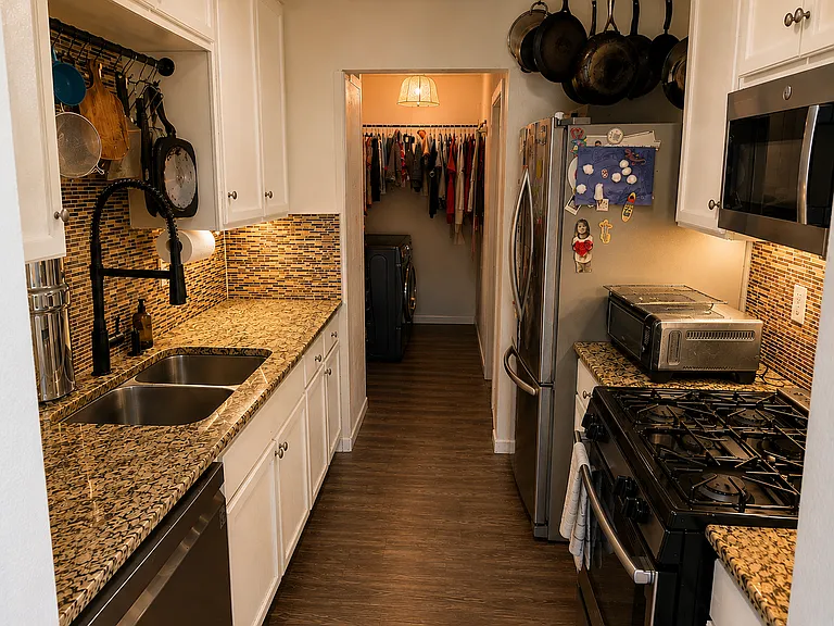 Kitchen and laundry room beyond