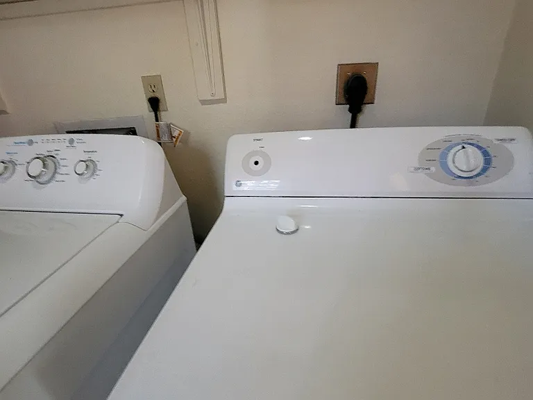 Washer and dryer with shelving in the laundry room