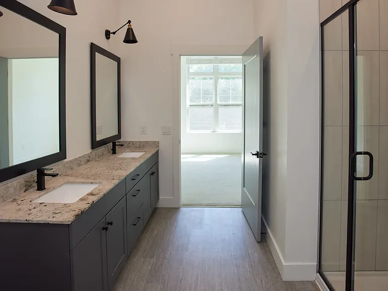 Bathroom With Double Vanity and Hard Surface Flooring