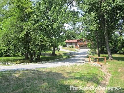 Canopy of Trees Surround Driveway
						:
						Driveway off dead end street makes this yard quiet and safe for children