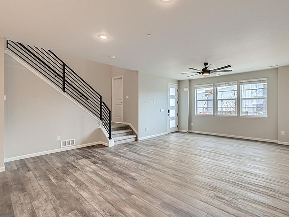 Open Concept Living and Dining Space with Upgraded Iron Banister