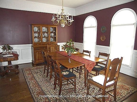 Dining room with wainscoting and columns