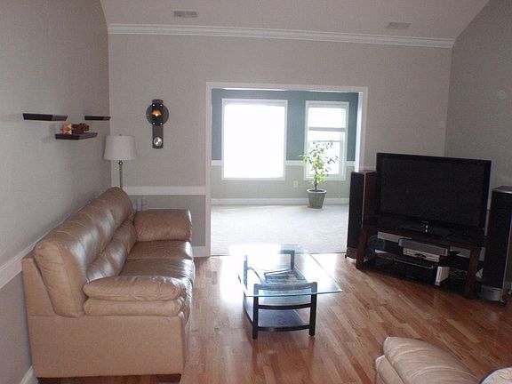 Living Room W/ Vaulted Ceiling
