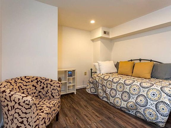 Daybed in sleeping nook attached to living room