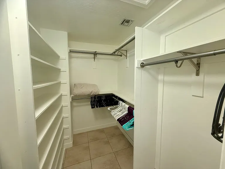 Queen Bedroom 2 walk in closet with built in shelving